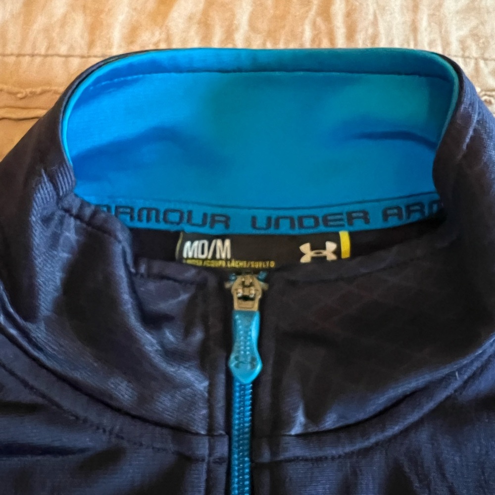 Men’s medium Under Armour zip up track jacket.